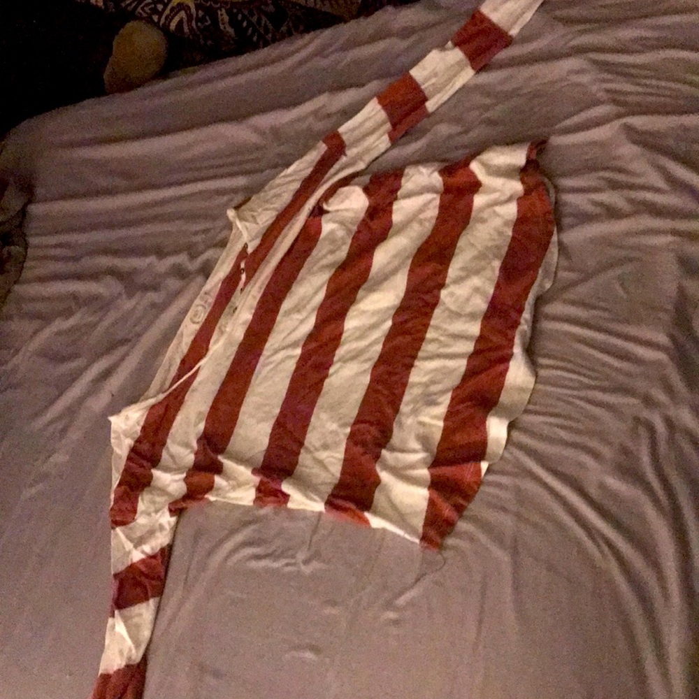 Coral and white slightly off shoulder shirt.